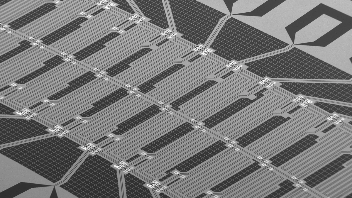 Symbolbild: Elektronenmikroskop-Aufnahme eines supraleitenden Quantenchips mit 24 künstlichen Atomen